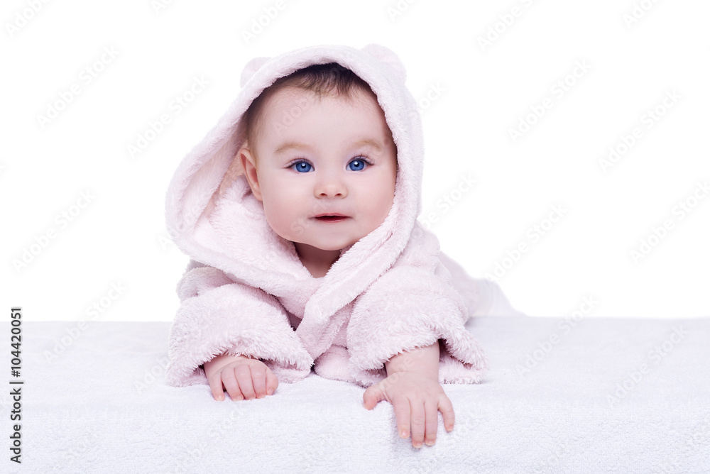 cute baby child in pink bathrobe lying down on blanket cute baby child in pink bathrobe lying down on blanket