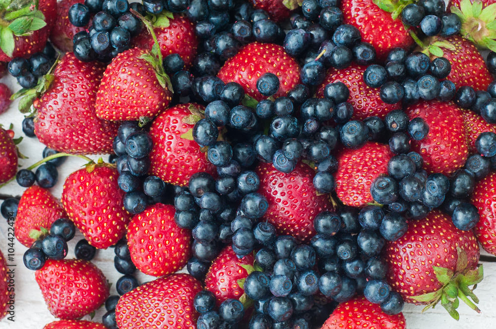 Strawberries and blueberries on a white background Strawberries and blueberries on a white background