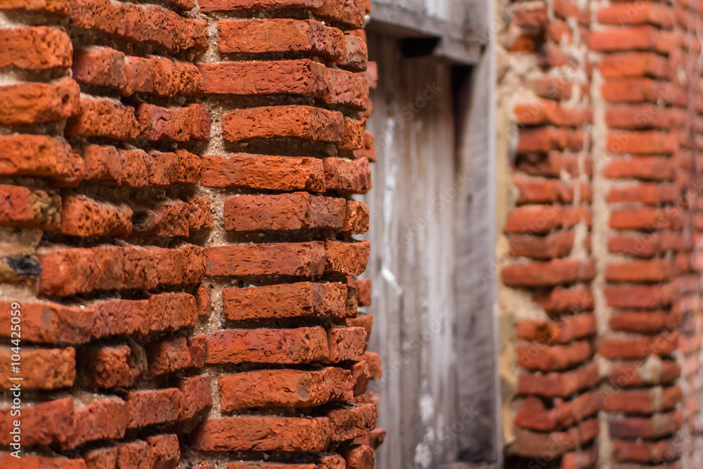 Ancient brick wall from side view background vintage
