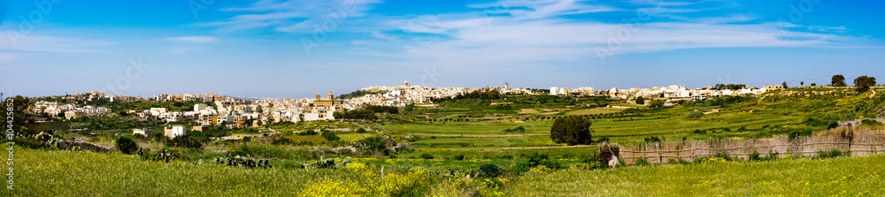 Panorama view of Mgarr city with green field. Gozo, Malta