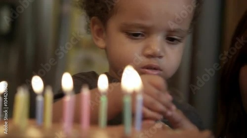 Wallpaper Mural Young boy crys after he burns himself on birthday candle. His mother tries to confort him. Torontodigital.ca