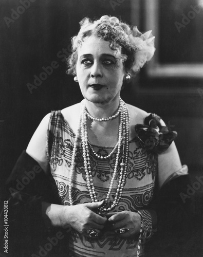 Portrait of woman wearing several necklaces 