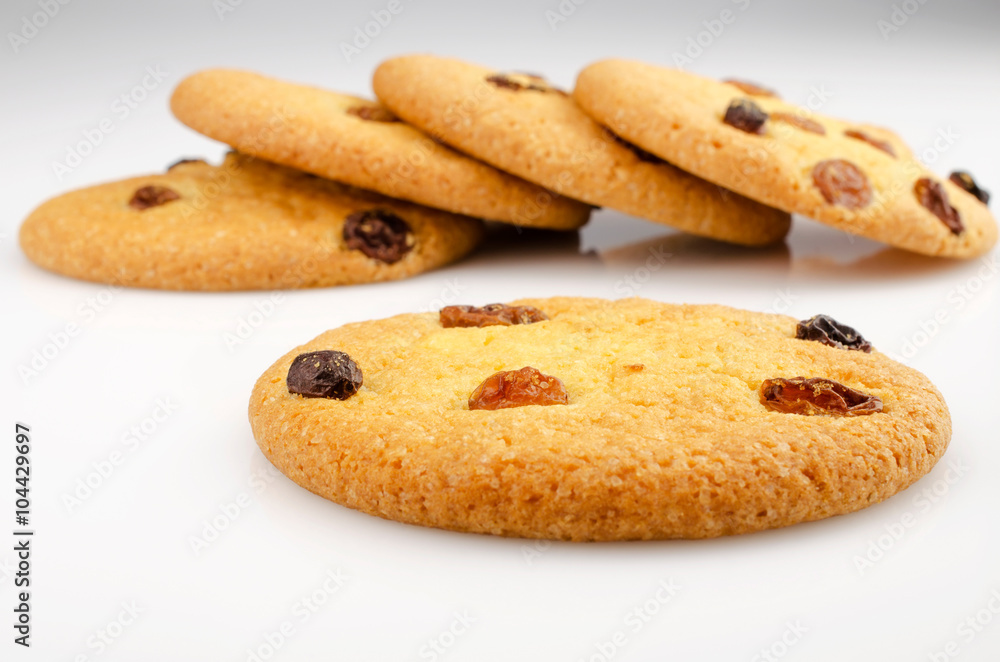 Confectionery theme. Cookies with raisins on a white background. Closeup