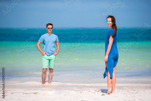 Young couple on white beach at summer vacation