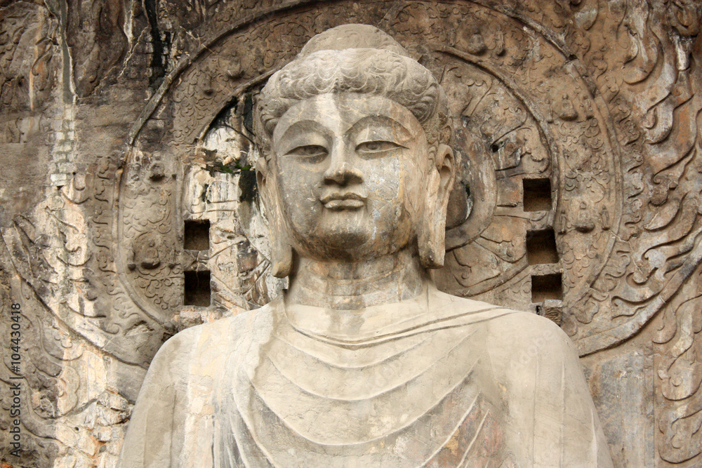 Buddha's statue in Longmen Grottoes at Yi River, Luoyang City, Henan province, China