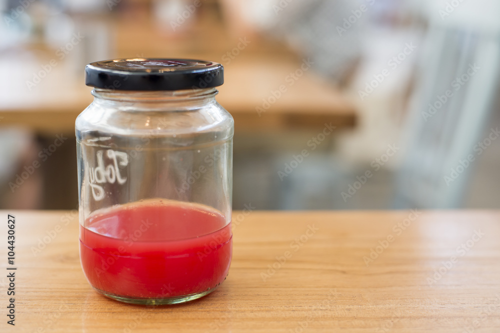 Sweet red mug on a wooden table Sweet red mug on a wooden table