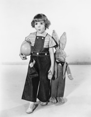 Little girl standing with a Easter bunny 