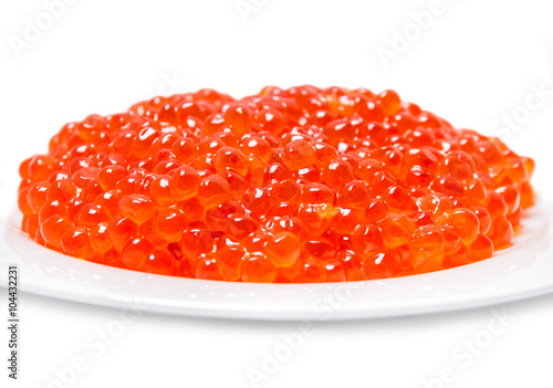 Red caviar on plate on white background