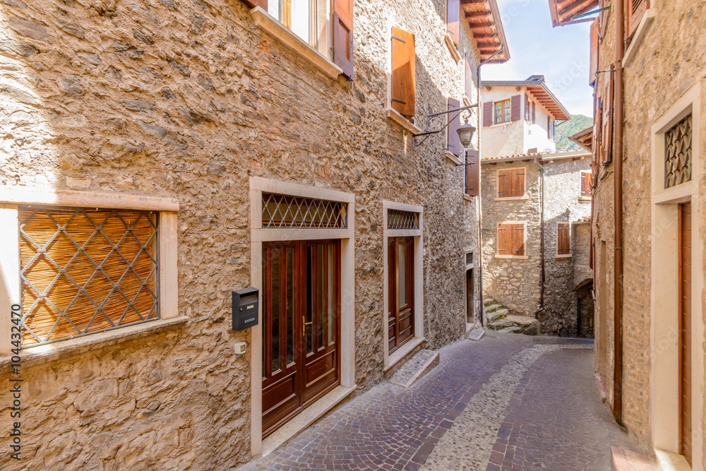 Fototapeta premium Picturesque small town street view in Limone, Lake Garda Italy.