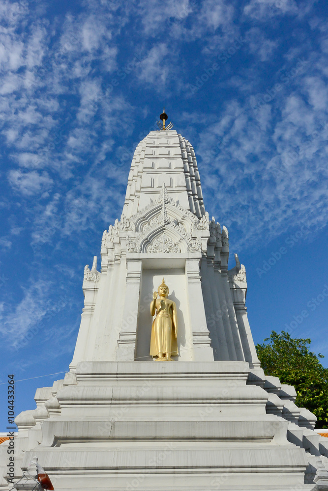 White pagoda with small golden Buddha image and blue sky in Phra Sri Mahatat temple, Bangkok, Thailand