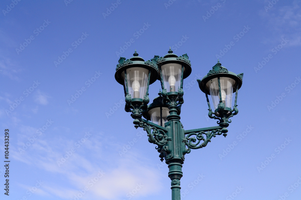 old vintage  street lamp with blue sky