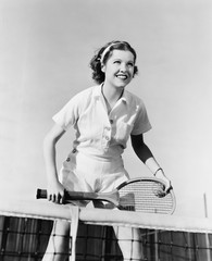Fototapete Vintage Poster Tennisspielerin am Netz im Fokus  © everettovrk