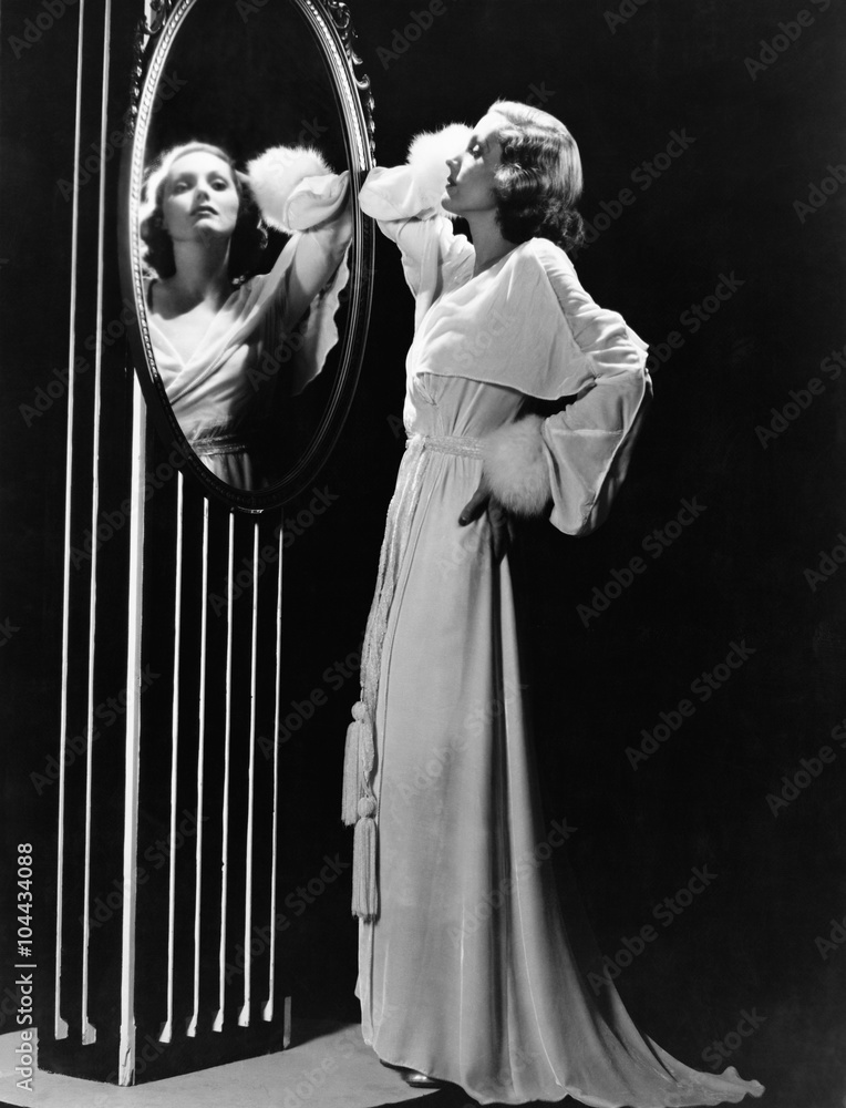 Fototapeta premium Glamorous woman looking in mirror 