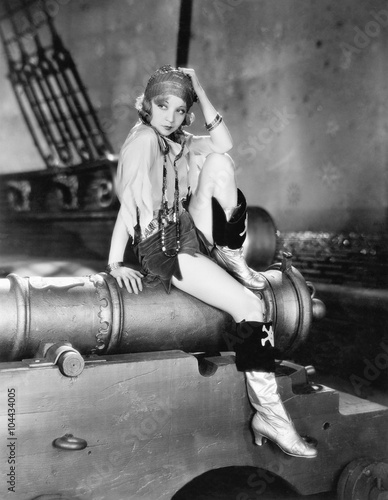 Profile of a young woman sitting on a cannon and thinking  © everettovrk