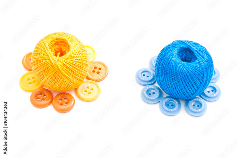colored buttons and two balls of yarn colored buttons and two balls of yarn