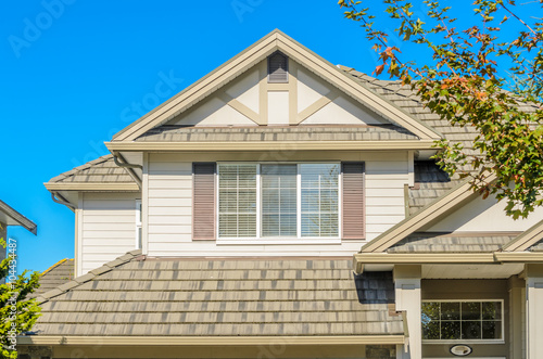 The roof of the house with nice window.