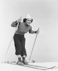 Fotobehang Wintersport Skiërs op steile besneeuwde helling  © everettovrk