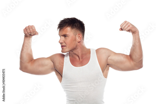 young sportsmen demonstrates biceps