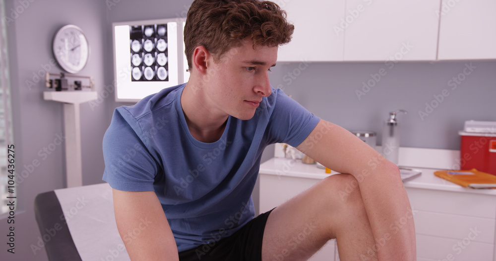 Good-looking caucasian male waiting for doctor Good-looking caucasian male waiting for doctor