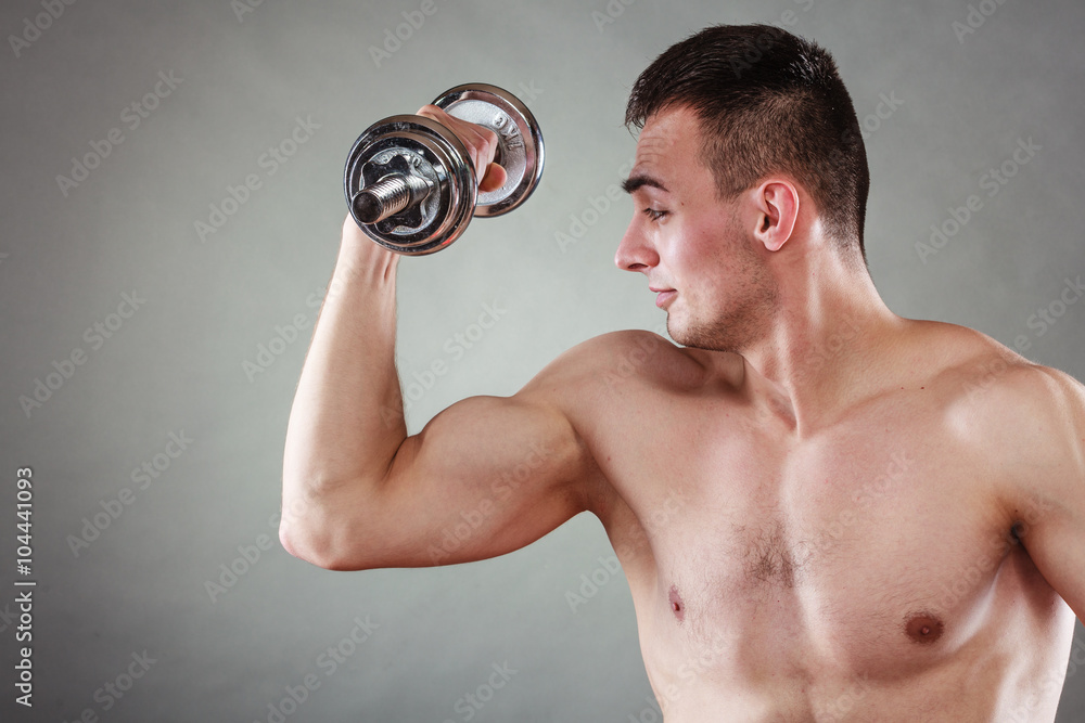 athletic man working with heavy dumbbells athletic man working with heavy dumbbells