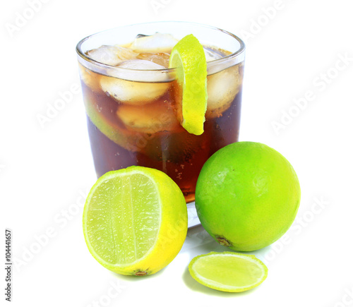 Cocktail with whisky, cola and fresh lime isolated on white background