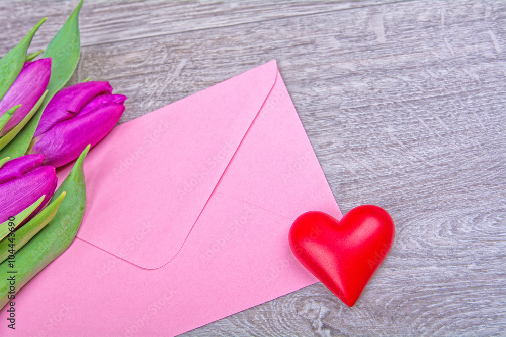 Pink envelope with red heart and purple tulips Pink envelope with red heart and purple tulips