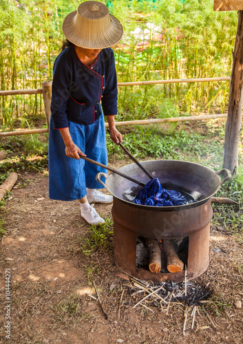 Dyeing Pots with colorful yarns dyed to blue fabric
