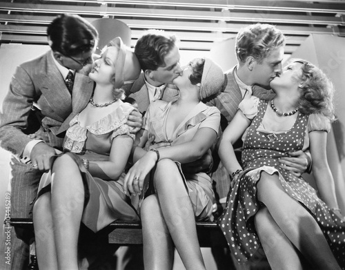 Three couples romancing and kissing  photo