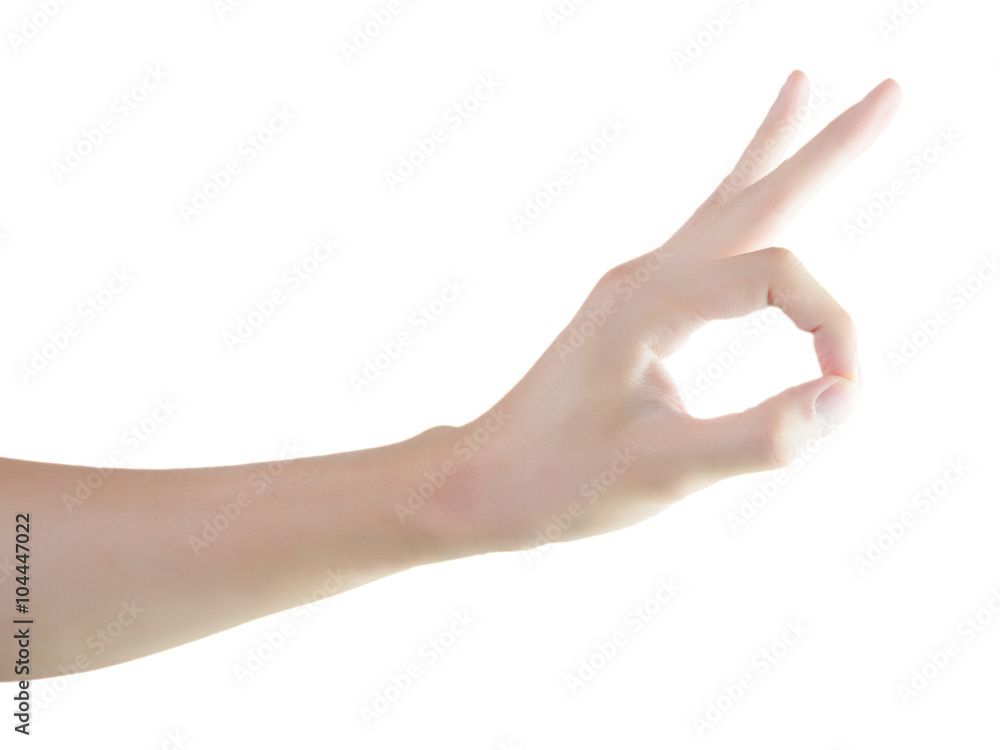 Closeup of hand showing okay sign on isolated white background with clipping path Closeup of hand showing okay sign on isolated white background with clipping path