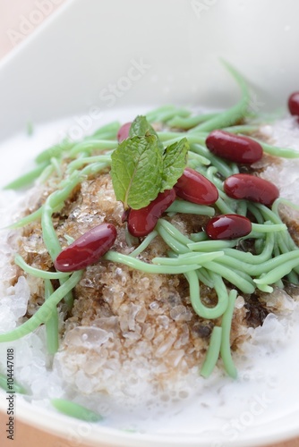 Closeup of cendol dessert with gula Melaka syrup photo