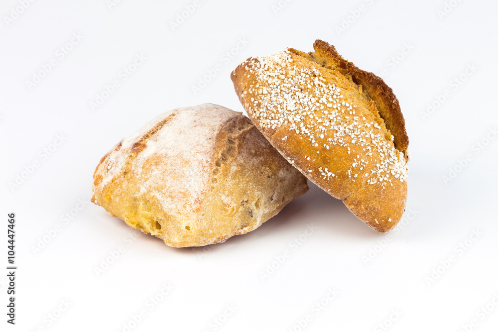 Composition with bread and rolls isolated on white Composition with bread and rolls isolated on white