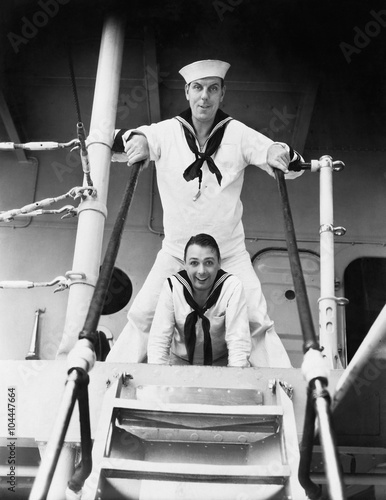 Two sailors standing on a gangway 