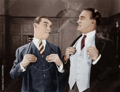 Two men smoking cigars  