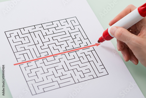 Photos Woman Hand Drawing Straight Red Line Over Maze