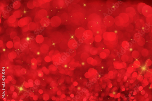 Red ray bokeh glitter defocused lights christmas abstract background.
