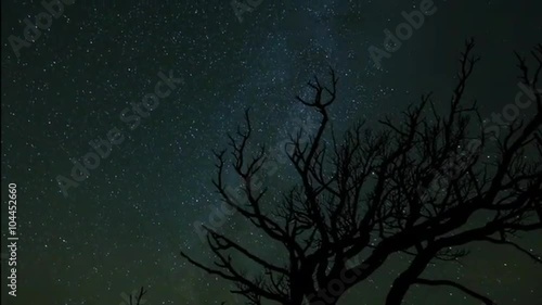 A beautiful time lapse sunset over a night time desert scene. photo