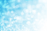 Blue ray bokeh glitter defocused lights abstract background.