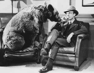 Thoughtful man with bear 