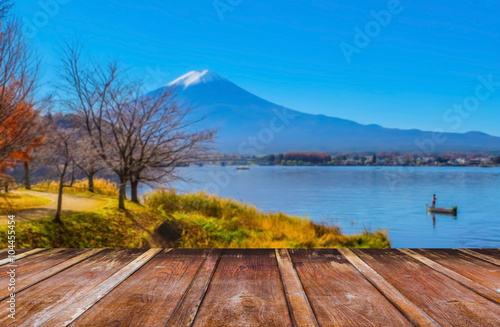 wood table and blur image of "fuji" mountain in japan for backgr