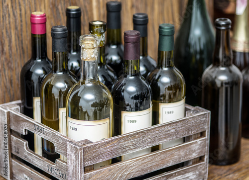Wine bottles in a wooden crate .