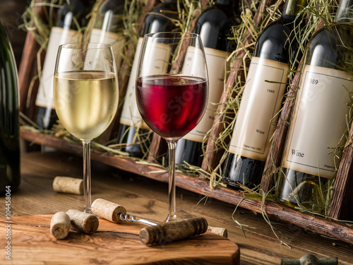 Fotografie Wine bottles on the wooden shelf.