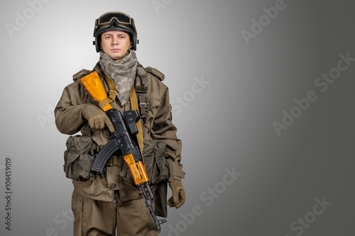 Soldier with rifle and mask