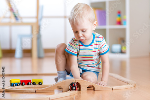 Child boy playing with wood...