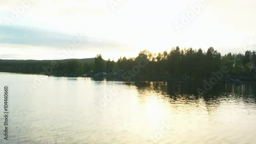 Aeria dronel shot of beach house at sunset