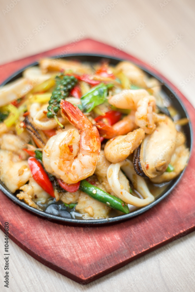 Sizzling seafood with Thai herbs.