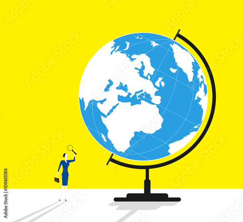 Searching / A business woman is holding a magnifier and looking on a globe