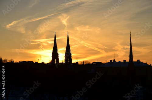 Helsinki silhouette at sunset. Towers of the St. John's Church and the German Church.