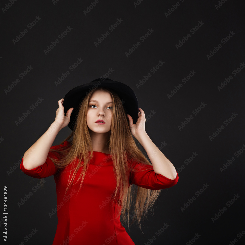 Full-length portrait of beautiful young girl in red dress and bl Full-length portrait of beautiful young girl in red dress and bl