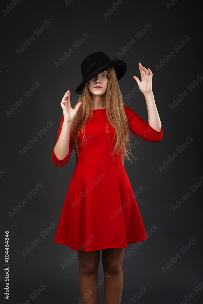 girl in red dress and black hat. girl in red dress and black hat.