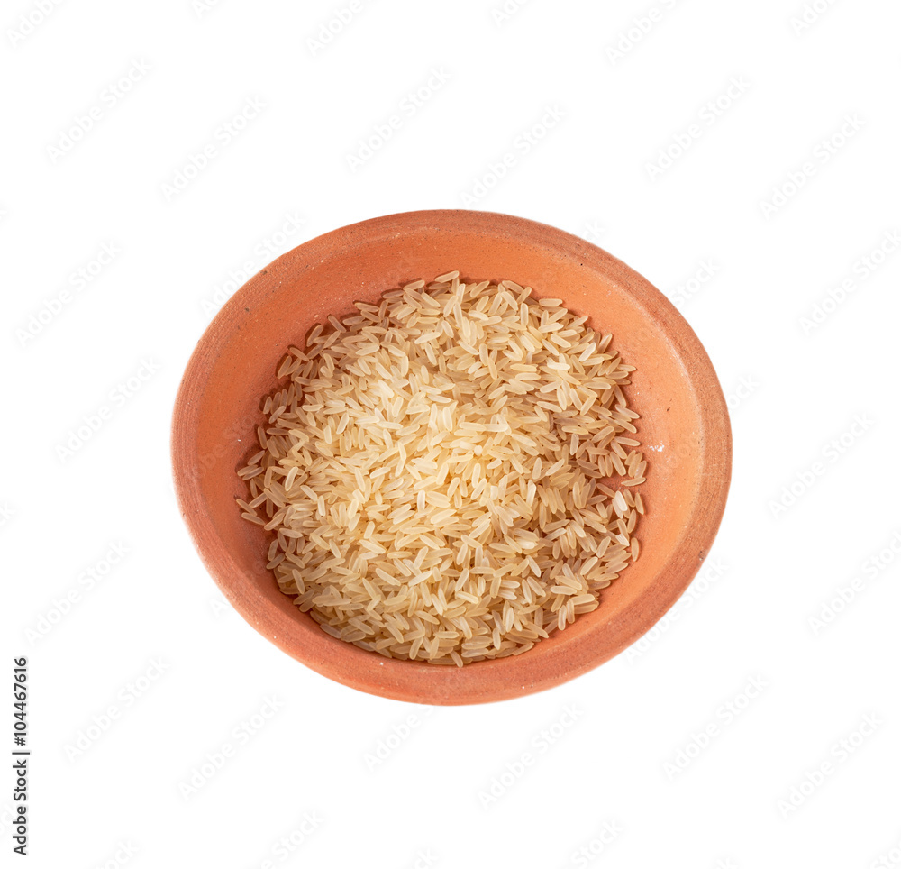 Rice in a clay bowl isolated on white background Rice in a clay bowl isolated on white background